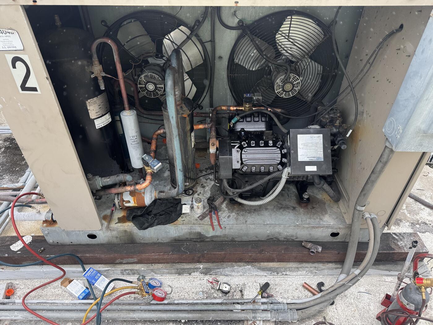 Carney technician working on a condensing unit
